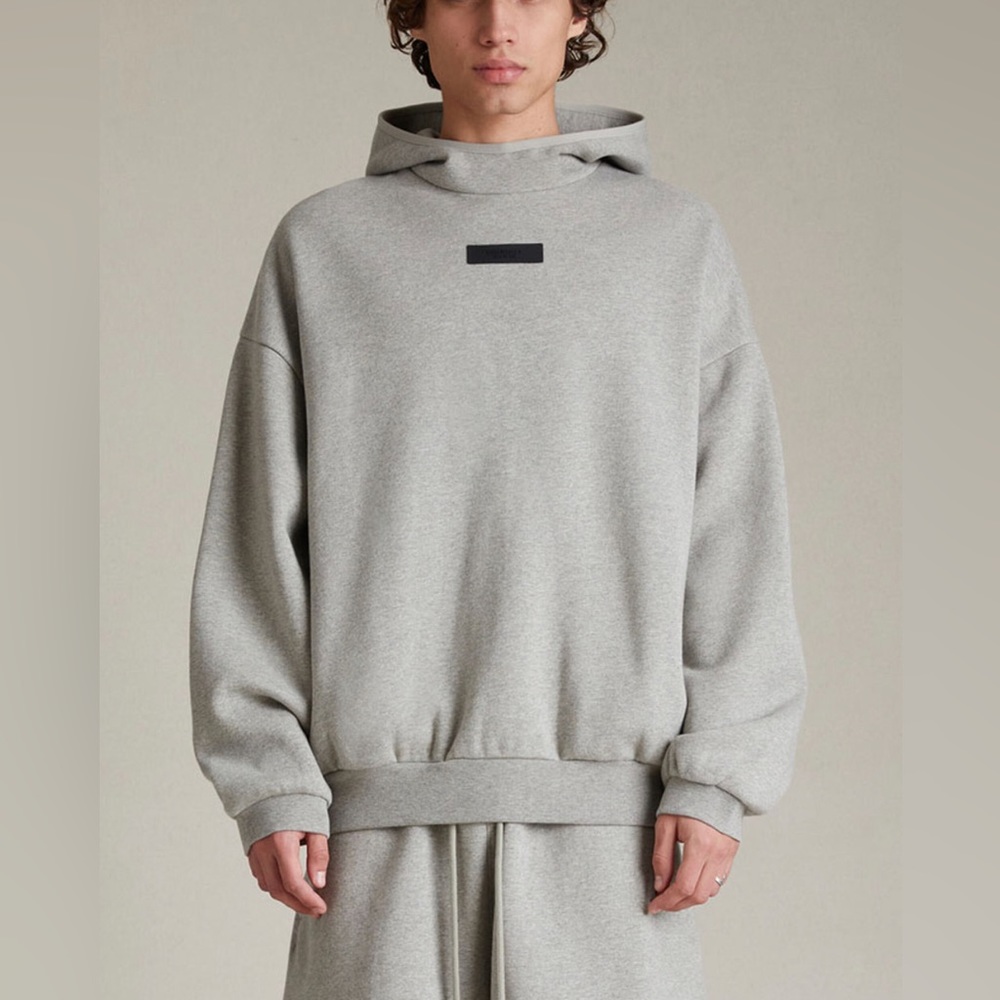 FEAR OF GOD ESSENTIALS - Dark Heather Oatmeal Hoodie.